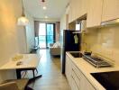 Modern kitchen with open floor plan leading into the living room area