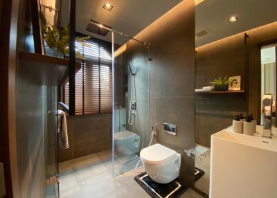 Modern bathroom interior with glass shower and elegant design