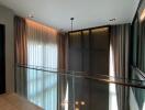 Modern hallway with elegant curtains and glass balustrade