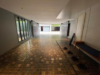 Spacious entrance hall with tiled flooring and natural light