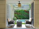 Cozy patio area with comfortable seating and a vertical garden