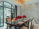 Elegant dining room with modern chandelier and marble walls