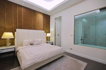 Modern bedroom with en-suite bathroom and glass wall