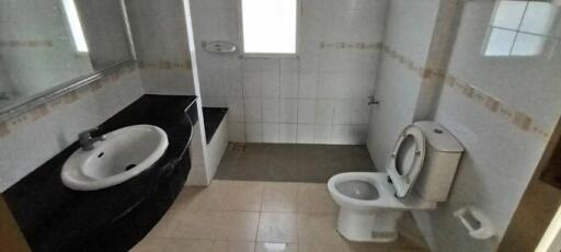 Compact bathroom with sink, toilet, and bidet