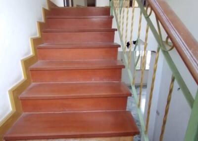 Wooden staircase with handrails in a residential home