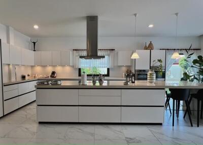 Modern kitchen with marble flooring and central island