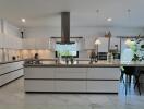 Modern kitchen with marble flooring and central island