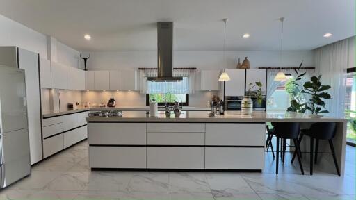 Modern kitchen with marble flooring and central island