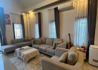 Cozy living room with modern furniture and ample seating
