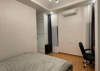 Modern bedroom with air conditioning and office space