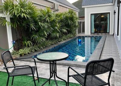 Cozy outdoor patio area with swimming pool