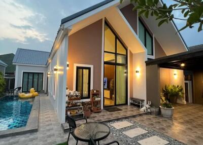 Modern house exterior with swimming pool at dusk