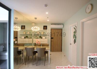 Modern dining room with open floor plan and elegant decor.