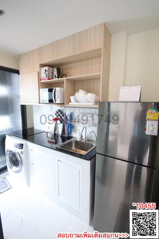 Modern kitchen with stainless steel appliances and wooden cabinets