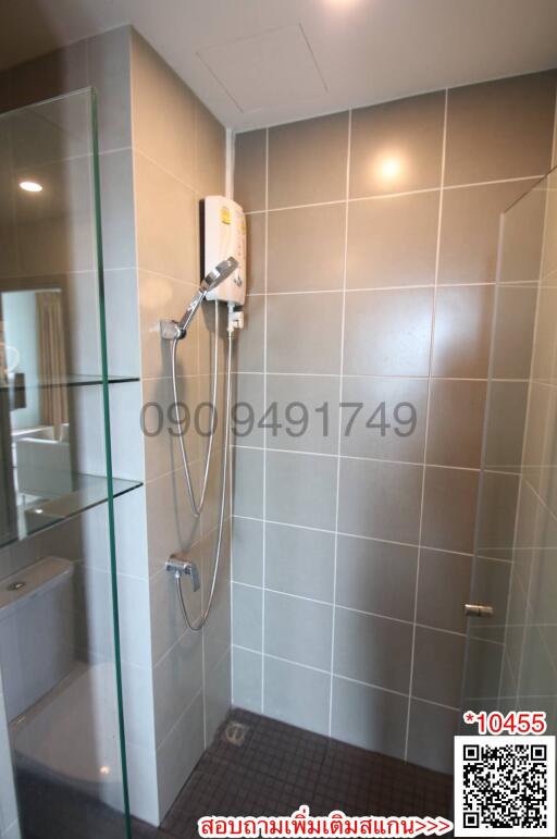 Modern bathroom with glass shower and wall-mounted water heater