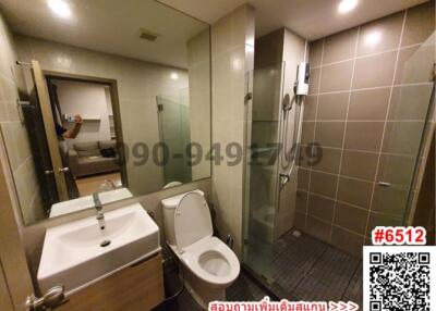 Modern spacious bathroom with shower and toilet