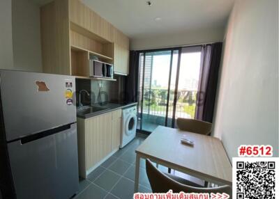 Modern kitchen with appliances and dining area