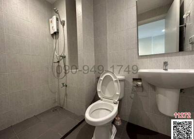 Modern bathroom interior with toilet, shower and sink