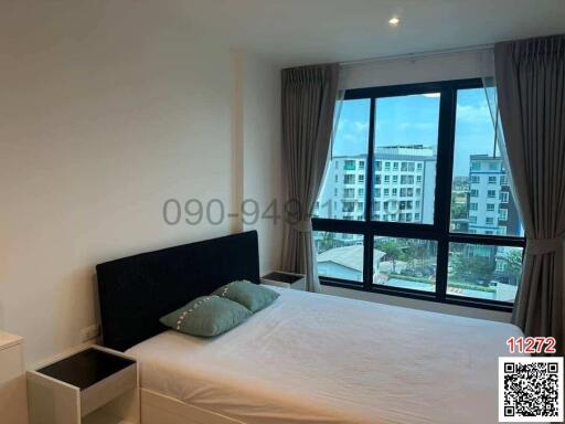 Bedroom interior with large window and contemporary design