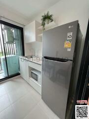 Modern kitchen with stainless steel appliances and white cabinets