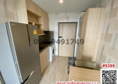 Compact modern kitchen with wood-finished cabinets and equipped with appliances