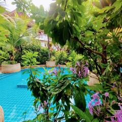 Lush garden with swimming pool and vibrant plants