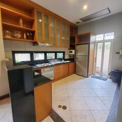 Spacious kitchen with modern appliances and ample cabinetry