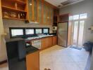 Spacious kitchen with modern appliances and ample cabinetry