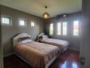 Spacious Bedroom with Twin Beds and Large Windows