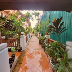 Well-maintained pathway leading through a residential garden