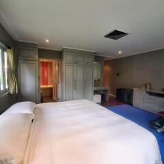Spacious master bedroom with built-in wardrobes and en-suite bathroom
