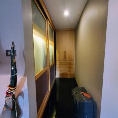 Hallway with artistic decorations and built-in wooden cabinet