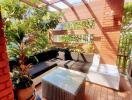 Cozy and lush balcony with seating and plant decorations