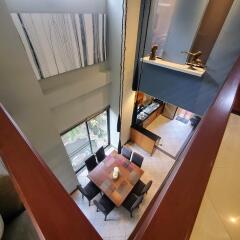 High angle view of a modern dining area with large windows