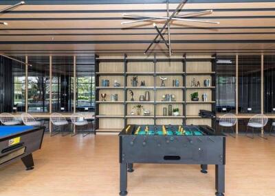 Spacious game room with pool and foosball tables