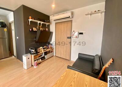 Cozy living room with modern furnishings and ample shelving