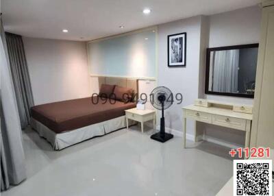 Modern bedroom with large bed and glossy floor