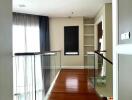 Modern hallway interior with wooden flooring and natural light