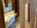 Spacious bathroom with modern amenities and wooden accents