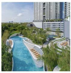 Luxurious outdoor pool with lush greenery and lounging areas in a modern apartment complex