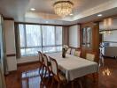 Elegant dining room with chandelier and hardwood floors