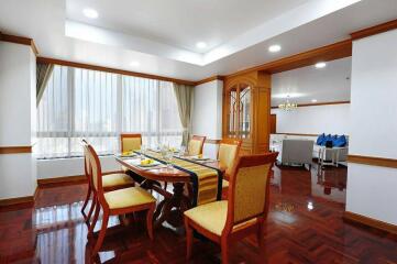 Spacious dining room with large windows and hardwood floors