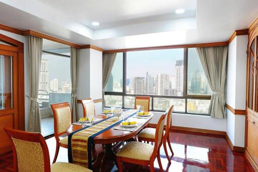 Spacious dining room with city views and abundant natural light