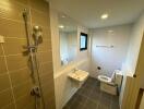 Modern bathroom with walk-in shower and beige tiles