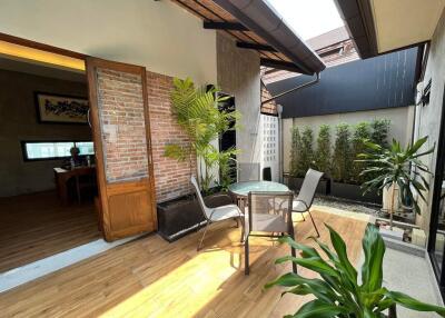 Spacious indoor patio with natural light and greenery