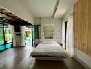 Spacious bedroom with direct pool access and natural lighting