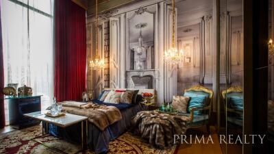 Elegant bedroom with classic French interior design, luxurious furnishing and natural light