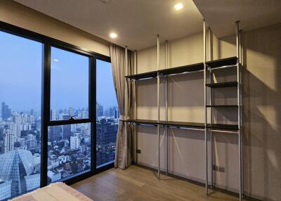 Spacious living room with city view through large window