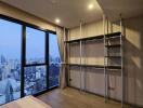 Spacious living room with city view through large window