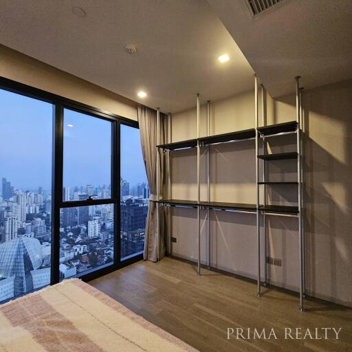 Spacious living room with city view through large window